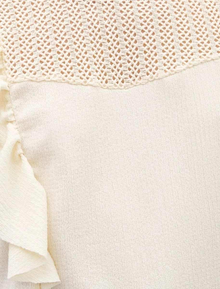 Sleeveless Ruffle Shoulder Blouse in Cream