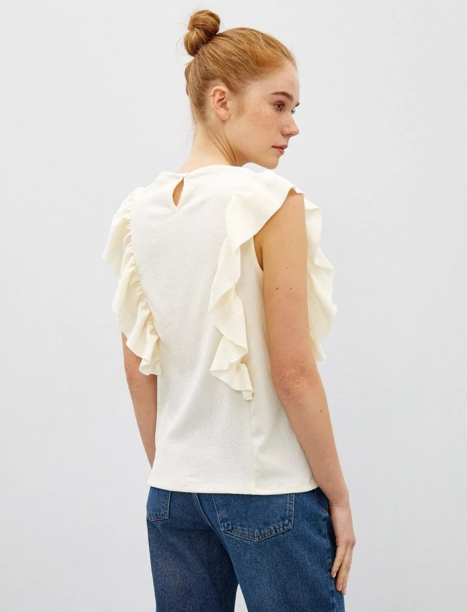Sleeveless Ruffle Shoulder Blouse in Cream